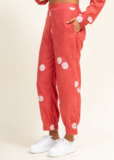 A Model Wearing Peach Upcycled Cotton Coral Tucked Pants, curated by Only Ethikal